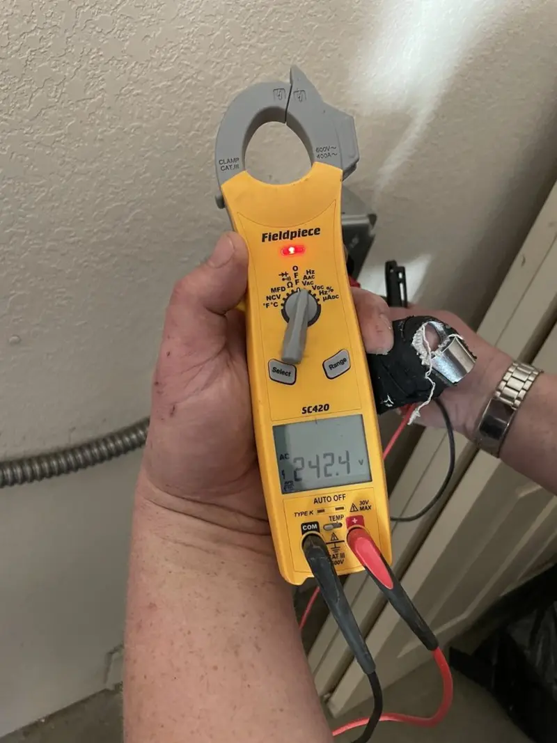 Voltage testing with clamp meter during Ceiling Fan Installation in Bloomer